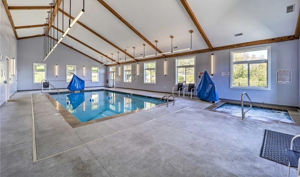 Indoor pool and hot tub side by side in the Sugar Ski & Country Club clubhouse