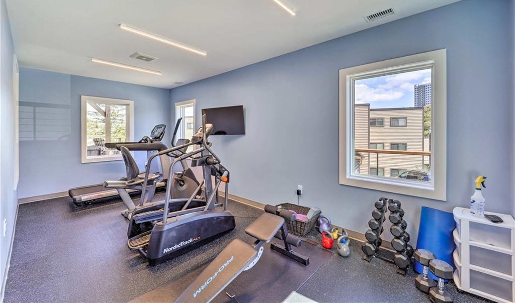 Fitness center at Sugar Ski & Country Club with treadmill, elliptical and free weights