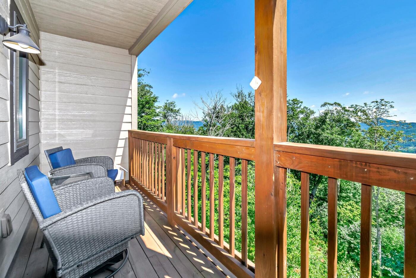 Private balcony with seating overlooking the Blue Ridge Mountains