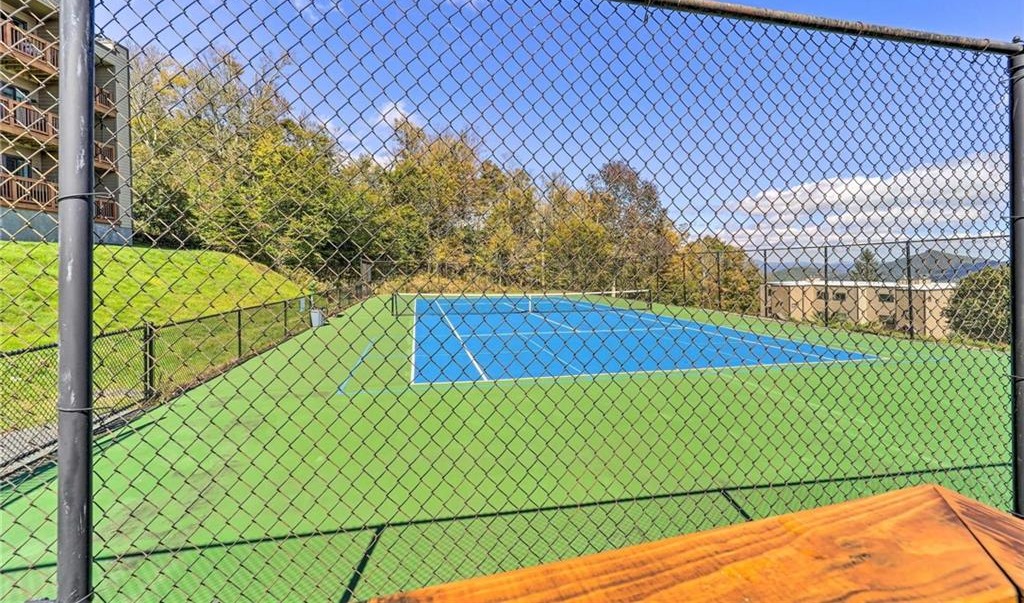 Tennis and pickleball courts surrounded by mountain views at Sugar Ski & Country Club